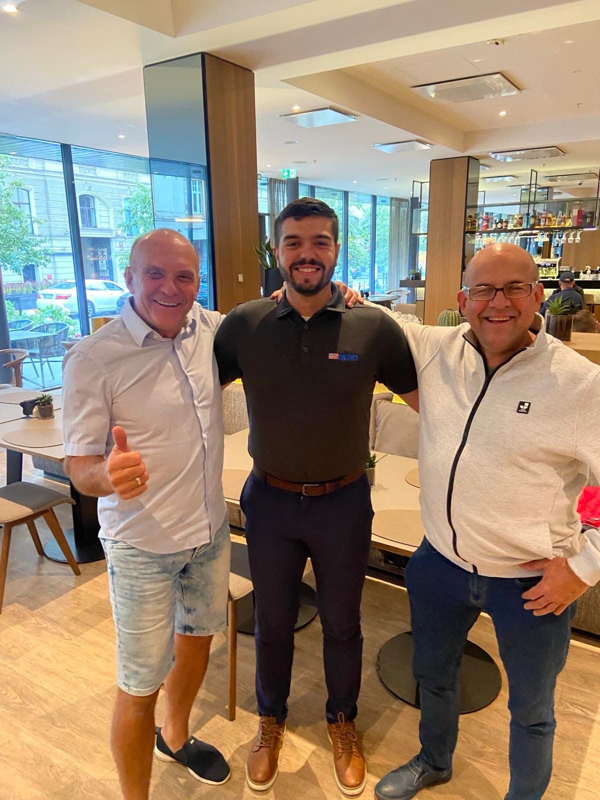 Alvydas Kurauskas, Kevin Banks, Arturas Melnikas Meeting in Restaurant